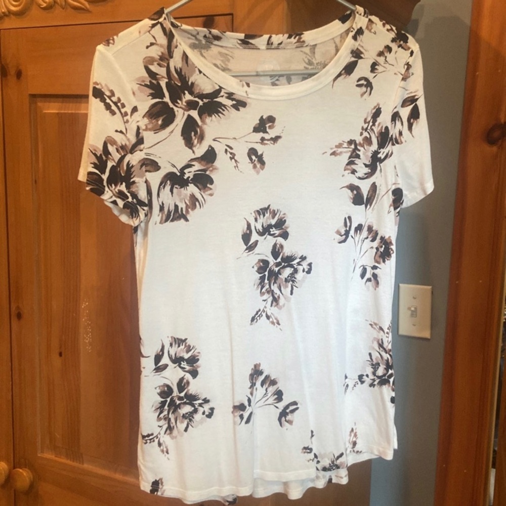 White dress top with flowers.